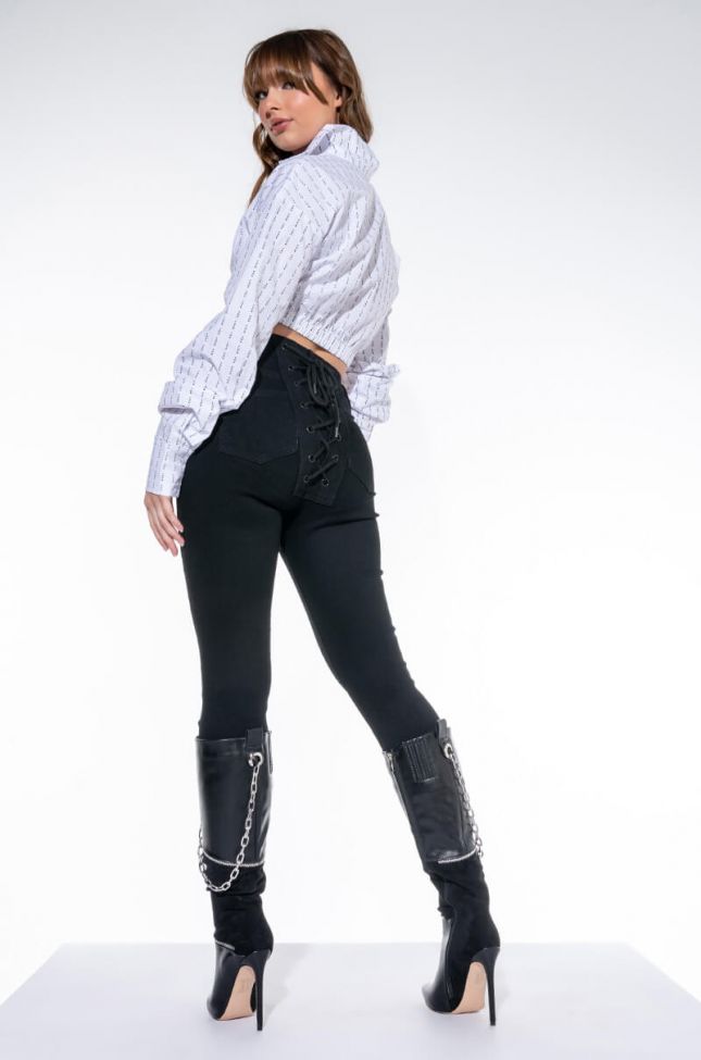 Side View All Over Lace Up Back Skinny Jeans
