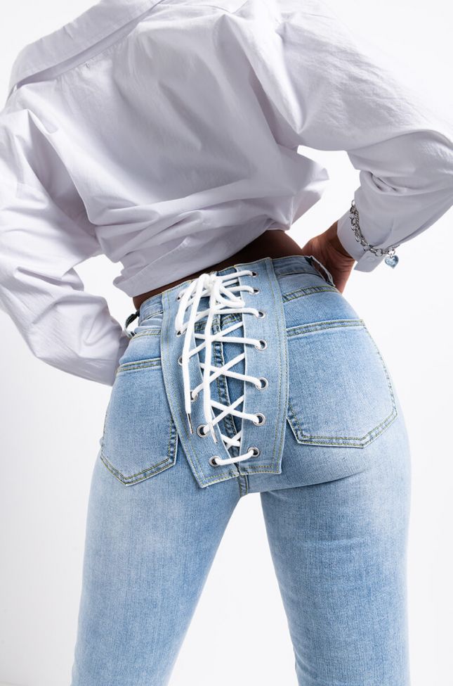 Detail View All Over Lace Up Back Skinny Jeans in Light Blue Denim