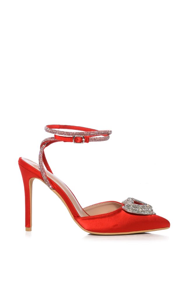 Side View Broken Lines Red Pump With Heart Embellishment