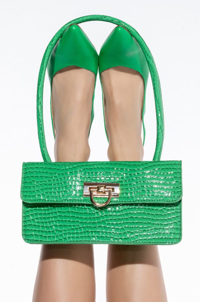 ITS THE GREEN CROC PURSE FOR ME