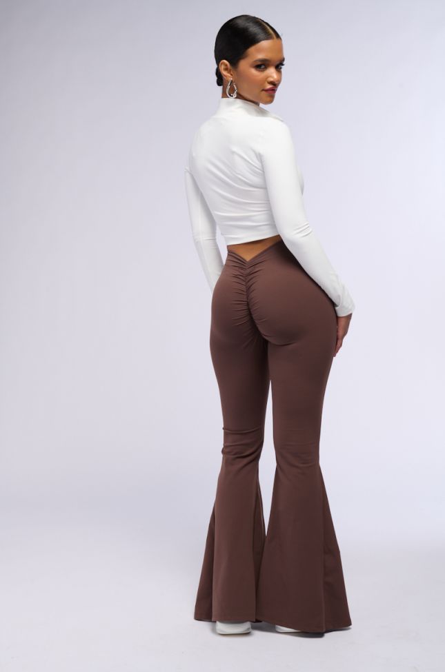 Extra View On The Run Ruched Back Flare Legging In Brown
