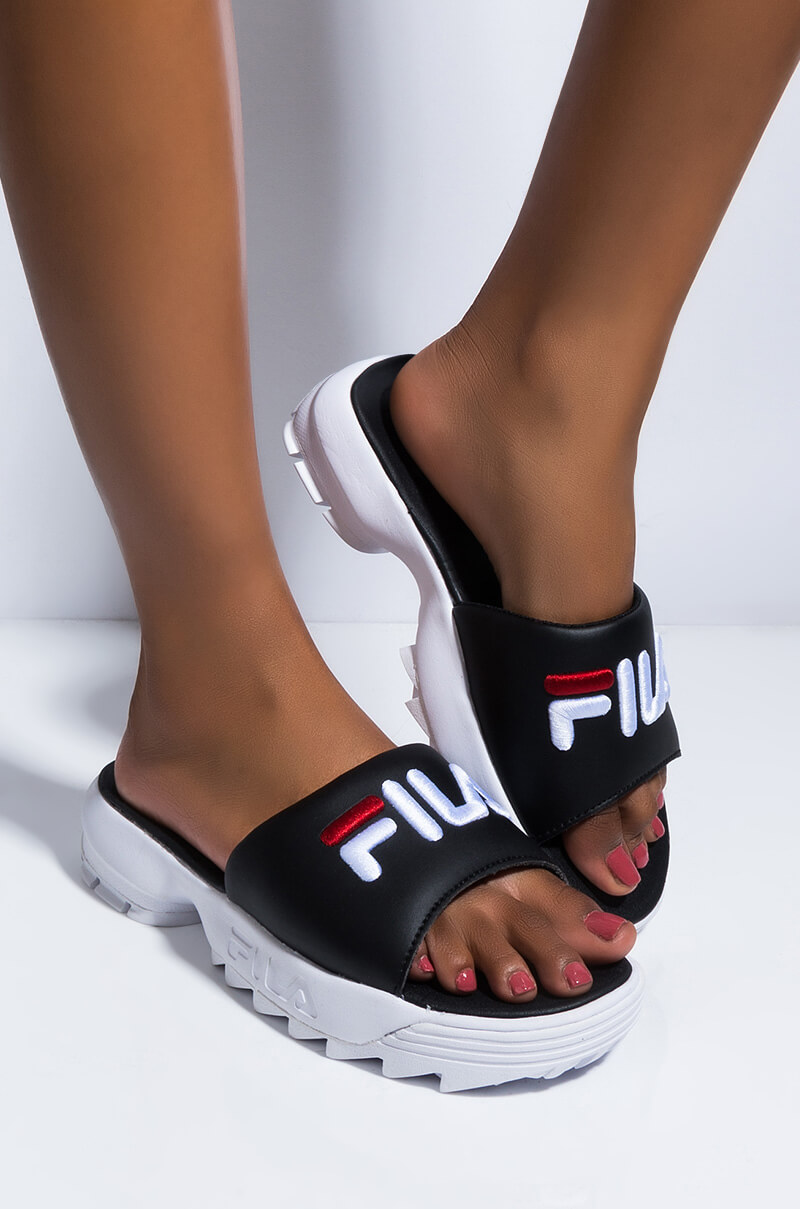 fila disruptor sandals on feet